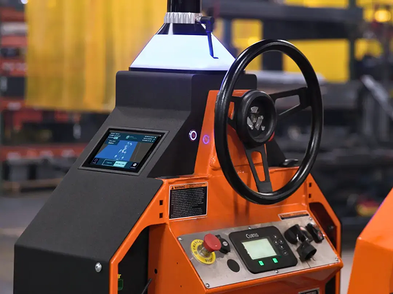 Beetronics 7TS7M touchscreen HMI mounted on the operator console of Cyngn's DriveMod Tugger, alongside the steering wheel and control panel