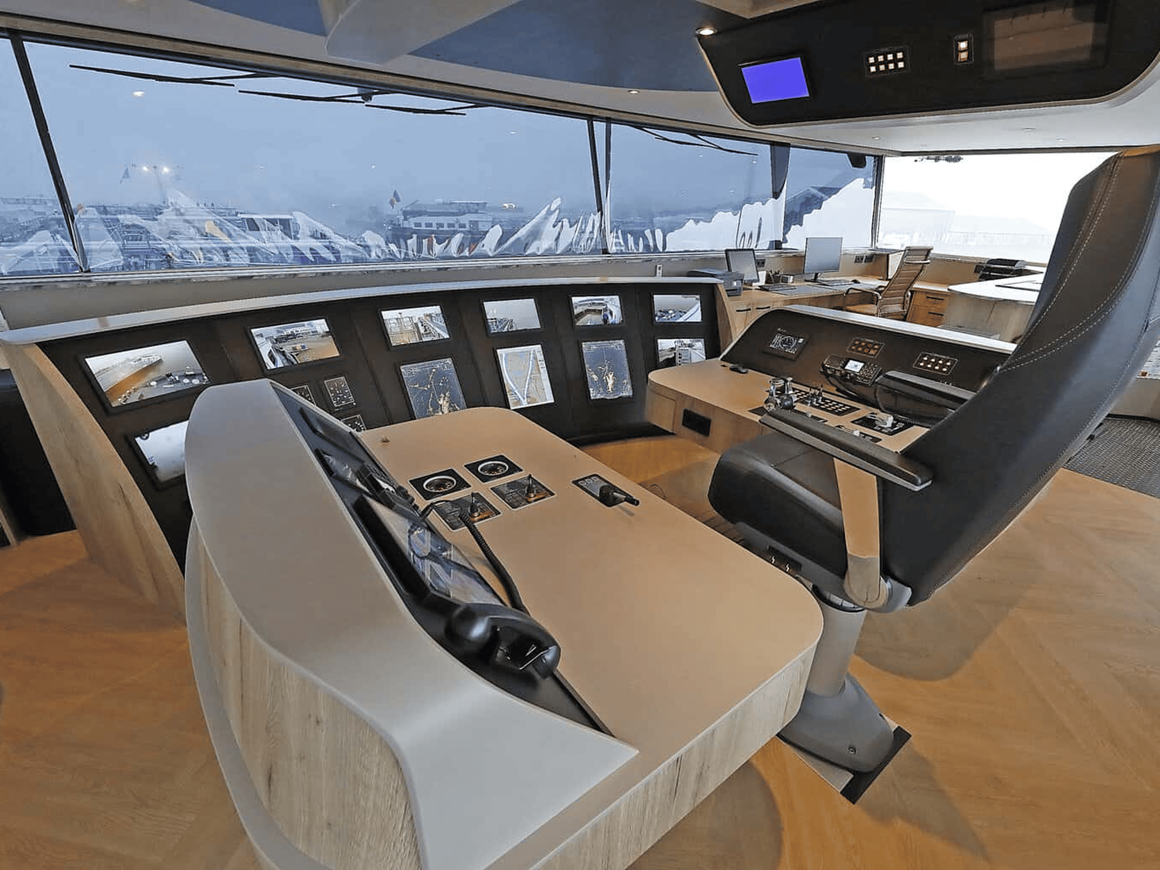 Close view of a panel-mount marine touchscreen on the vessel bridge.